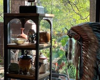 Asian head figure, Native American headdress.