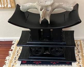 Ashanti wooden stools and fossile whale bone vertebrae