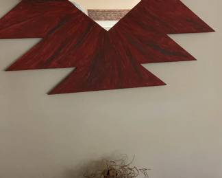 Funky Mirror And A Red Pot With Desert Style Flowers