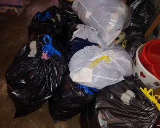 Bags of New socks, hats, gloves, scarves