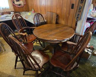 #60	Kitchen table wood with 1 leaf 2 captains chairs 4 regular chairs (as-is finish) 41" roundx 30" Leaf 20"	 $45.00