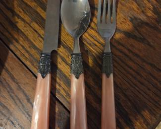 #75	Gibson stainless coral color flatware	 $20.00