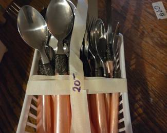 #75	Gibson stainless coral color flatware	 $20.00