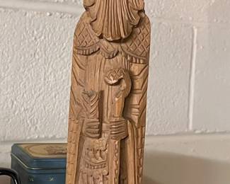 Vintage hand-carved folk art wooden statue, possibly depicting a wise man, monk, or religious figure