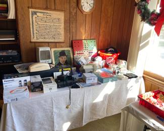 Lots of small electronics including a ZVOX sound machine (television sound bar), and an Atari flashback 5 classic game console, Magnavox DVD/VCR combo, cassette recorder and more