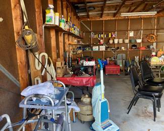 Black stacking office chairs, misc health equipment and various vacuum cleaners