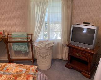 Quilt rack and nice small portable TV for movies and/or games. Nightstand matches the queen headboard set