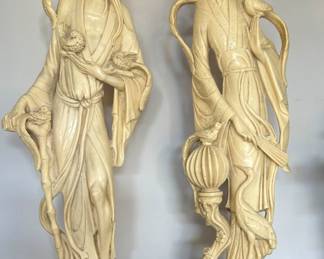 a pair of Asian-style statues