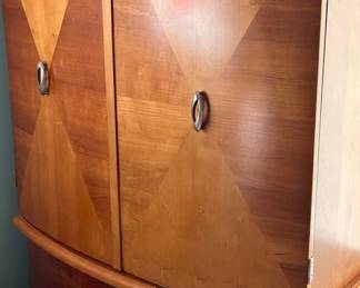 bow-front two-door, two-drawer armoire