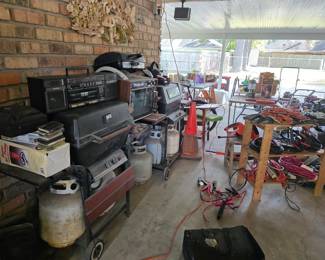 great collection of vintage tools, and essential garage items like lawn mowers and yard equipment.