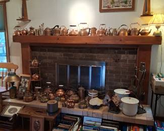 Collection of copper tea , kettles , teapots , coffee pots