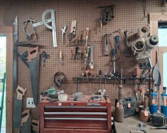 a wide variety of hand tools, including saws, wrenches, and measuring instruments