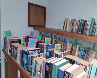 books are a mix of fiction and non-fiction titles, including works by authors such as Philip K. Dick, Ruth Rendell, and Martha Grimes.