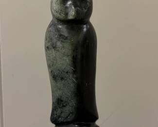 Inuit Figurine - Owl | Stone carving of a bird, possibly an owl, sitting tall with its wings tucked in close.  
Soapstone carving
Signed by artist (bottom): [indistinguishable]
Titled by artist: N/A
Numbered by artist: N/A