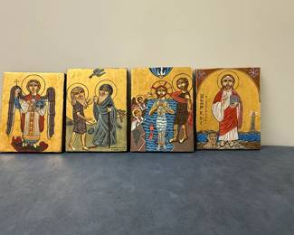 (4pc) Religious Paintings - Coptic Orthodox Church | Religious paintings of Coptic icons, including: 
"Saint Mark the Evangelist," a founder of the Coptic Orthodox Church having brought Christianity to Egypt in the first century, holding a book, with a lion and the Lighthouse of Alexandria in the background. 
"Jesus’s Baptism in the Jordan River" by John the Baptist, symbolizing the Theophany, the manifestation of the Holy Trinity.
"Saints Anthony the Great and Paul of Thebes" meeting in the desert, a pivotal moment in early Christian monastic tradition.
"Archangel Michael," a key figure in Christianity, Islam, and Judaism, is shown as a warrior angel battling evil.