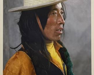 Jim Spillane (American, 1950s-) Photograph - "Tibet" | Portrait/side profile of a young man with long black hair wearing a yellow shirt, black vest and white hat.
Photograph
Framed (gold frame) and matted (white)
Signed by artist (lower right): "Jim Spillane" in pencil
Titled by artist (lower center): "Tibet"
Numbered by artist: N/A
Sight: h. 12" x w. 8.5" 
About the Artist: Jim Spillane is a fine art photographer who specializes in photographing people in the third world.  - h. 19.5 x w. 15.5 in (Frame)