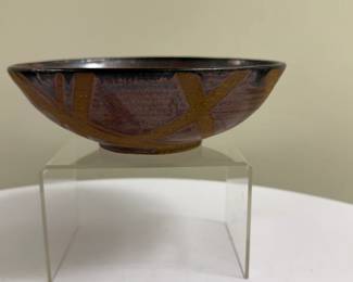 Studio Pottery - Red Clay Bowl | Studio pottery of a red clay ceramic bowl with a greenish-grey glaze and a star design on the underside. - h. 3 x w. 7 in