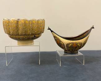 (2pc) Ceramic Pottery - Indian & North African | Ceramic pottery, including: Kashmir (India) lacquered brass fluted edge bowl, marked "Handmade by the Ali Brothers, Hassan Abad, Srinagar, Kashmir, India" on the underside.
North African lacquered copper"kashkul," or beggar’s bowl (boat-shaped vessel carried by wandering Sufi dervishes to collect alms in exchange for poetry or advice), marked "TRAKKA Collections" on the underside.