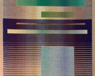 Grethen Romey Tanzer (American, 1957-) Woven Art - "Green Bar" | Tapestry of fine cotton thread, hand-woven into an abstract display of various shades of greens and blues.
Woven art
Framed (white frame)
Signed by artist: N/A
Titled by artist: "Green Bar" (also referenced in labels as "Shadows on Blue")
Numbered by artist: N/A - h. 24 x w. 20 in
