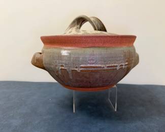 (2pc) Karen Karnes (American, 1925-2016) Ceramic Pottery - "Floor Jar" | Flame-proof stoneware glazed clay casserole dish with lid, top handle and side handles.
Ceramic pottery 
Signed by artist: Not signed but attributed to "Karen Karnes"
Titled by artist: N/A
Numbered by artist: N/A - h. 7.5 x w. 35 in