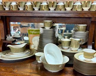 Sango China in the Versailles pattern. Crafted in Japan and features a sage green band with 22k gold filigree and trim. 98 Pcs.