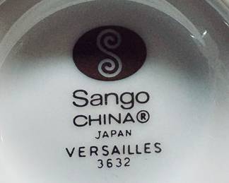 Sango China in the Versailles pattern. Crafted in Japan and features a sage green band with 22k gold filigree and trim. 98 Pcs.
