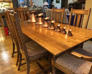 Barley twist English trestle table with six chairs Copper graduated measure pitchers 