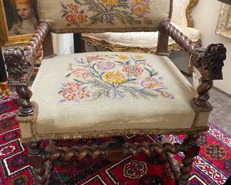 19 century early 20th century hand carved needle point chair with foo dogs.