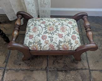 Antique upholstered foot stool