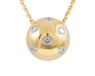 Vintage Tiffany & Co. Etoile ball pendant with round Natural Diamonds totalling approximately 0.18cts. Width: 10.8mm. 18ct yellow gold and Platinum 950 with Tiffany & Co 18ct yellow gold 41cm chain. Weight: 5.5g.