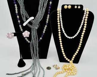 A SENT Murano black and white glass bead lariat necklace, a polished amethyst and rock crystal bead nnecklace, a pair of cultured pearl hallmarked gold earrings, and some classic Faux pearl necklaces and earrings