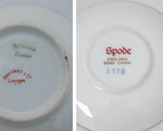 Closeup of Two Haviland Limoges porcelain saucers in their lovely Art Nouveau "Schleiger 492-1" or "Spider Mum" pattern; two Spode miniature bone china cups and saucers, one with a green border and one with a blue border, both featuring a floral pattern and gold trim