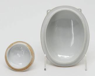 Reverse view of the two pieces of Hungarian Herend porcelain in the Rothschild Bird pattern: One oval lid with rosebud finial, 5" wide by 7" long, and one round lid with strawberry finial, 3" wide.