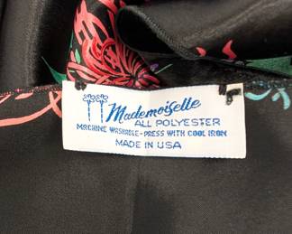 Closeup of the Mademoiselle scarf, black with Asian-style chrysanthemum floral pattern