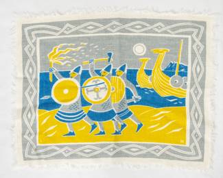 A vintage textile (a placemat?) printed in blue, yellow and gray in a style resembling woodcut or linocut prints, depicting Vikings on shore with their Viking ships in the background 