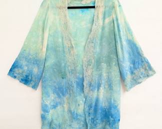 A vintage hand dyed robe or cardigan in a beautiful combination of blues and greens, edged with lace on the cuffs, front opening, and hem