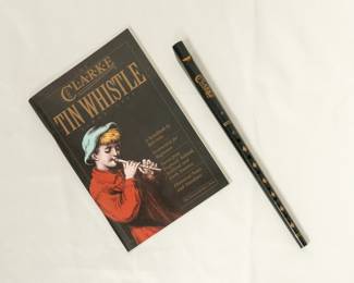 A Clarke Tin Whistle and accompanying instructional book, "The Clarke Tin Whistle" by Bill Ochs.