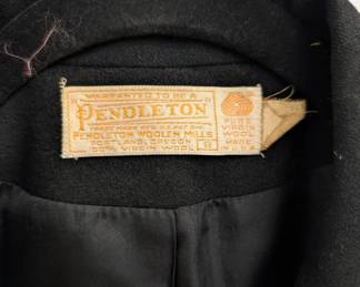 Closeup of the vintage Pendleton women's black wool skirt suit with two-button blazer and straight skirt, size 8