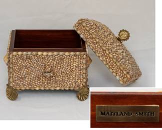 A decorative Maitland-Smith shell trinket box, highlighted with brass scallop feet and finial