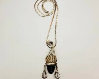 A spectacular and large Mexican silver and carved onyx pendant on a German sterling silver chain that measures 32-inches long, the pendant itself measures 3-7/8 inches long.