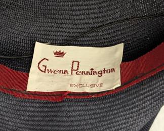 Inside view of the vintage Gwenn Pennington gray fascinator hat with netting and blue feathers