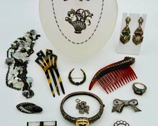 Vintage fashion jewelry, hair combs, moonstone cabochon brooch, a marcasite bracelet with 14k gold domed central cabochon, costume jewelry necklaces and rings