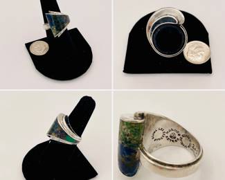 A bold statement sterling silver ring from Los Castillo in Taxco, Mexico, 1950s vintage, set with azurite and malachite. Signed and hallmarked "Los Castillo Taxco Mosaico Azteca Sterling Made in Mexico", with the eagle assay 15 and design # 245. 