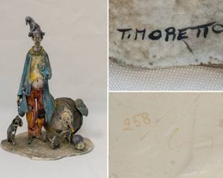 A signed Toni Moretto (Italian, 1929-2011), Lo Scricciolo ceramic sculpture of a clown with his drum, his dog and a tricycle, signed at front of base