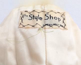 Another view of the vintage white fur stole with "The Style Shop Savannah GA" label inside
