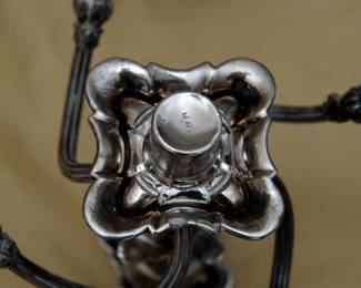 Maker's mark on the antique silver plated candelabra as seen on the underside of the removable five-light section that fits into the tall baluster form base