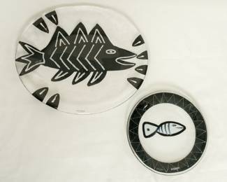 Two pieces of hand-painted art glass tableware (platters or plates) from Kosta Boda, designed by Swedish artist Ulrica Hydman-Vallien. Part of the "Kaboka" or "Caramba" series, known for its bold, hand-painted black details and fish motifs. 