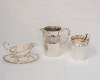A silverplate gravy boat with gadroon borders and shell feet, with underplate; a Paul Revere style silver plate water pitcher, and a silver plated ice bucket with tongs
