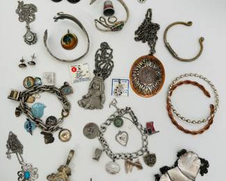 Find your eclectic fashion jewelry here - from a Betty Boop pin to charm bracelets, many with sterling silver charms; sunflower pendant necklace, copper cuff bracelet, a silver and abalone shell bracelet, and more