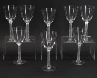 Eight signed Lalique Phalsbourg pattern Bordeaux wine glasses, 6 1/2 inches H. Each squared, frosted stem is molded with grape vines. Each sparkling glass is etched on the underside of the foot with Lalique France in script. Originally designed under Rene Lalique in 1924, this pattern was made 1924 - 2021.